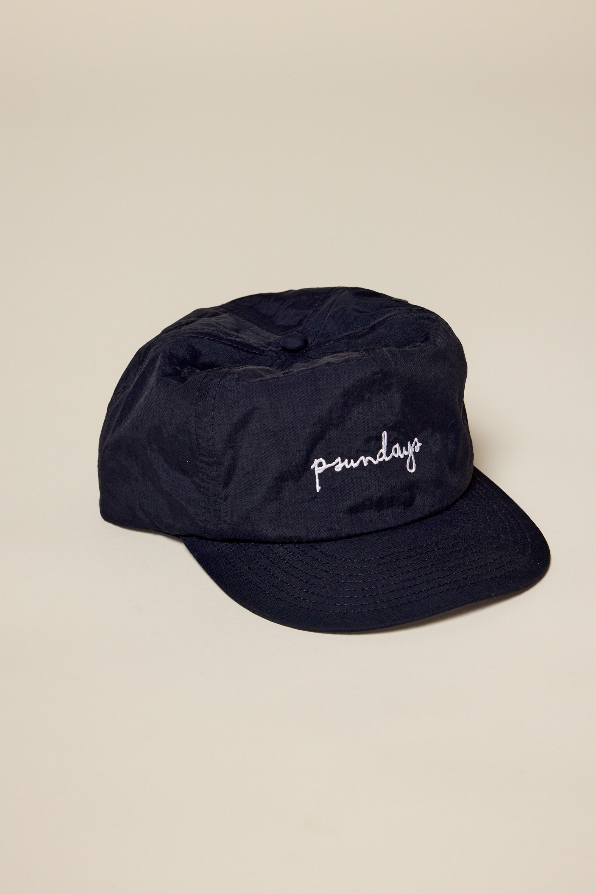 Black hat embroidered in white Psundays script